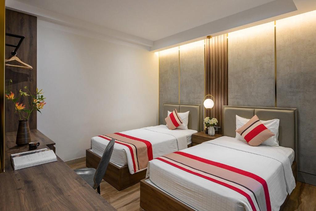 Postel nebo postele na pokoji v ubytování Acnos Hotel