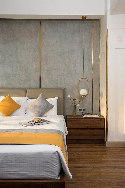 Postel nebo postele na pokoji v ubytování Acnos Hotel