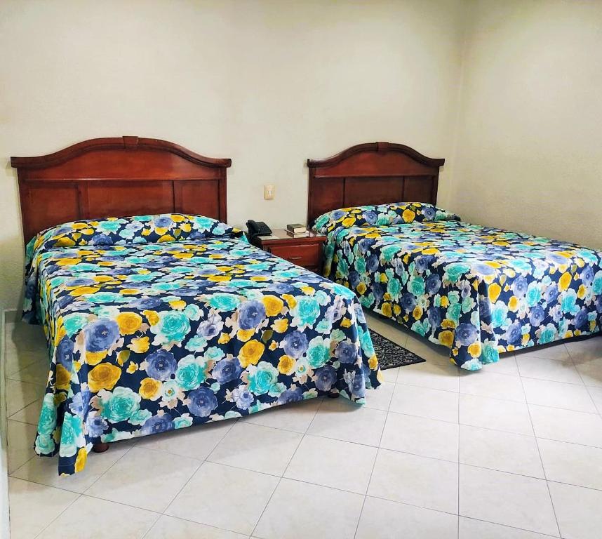 Postel nebo postele na pokoji v ubytování Novotel De Poza Rica