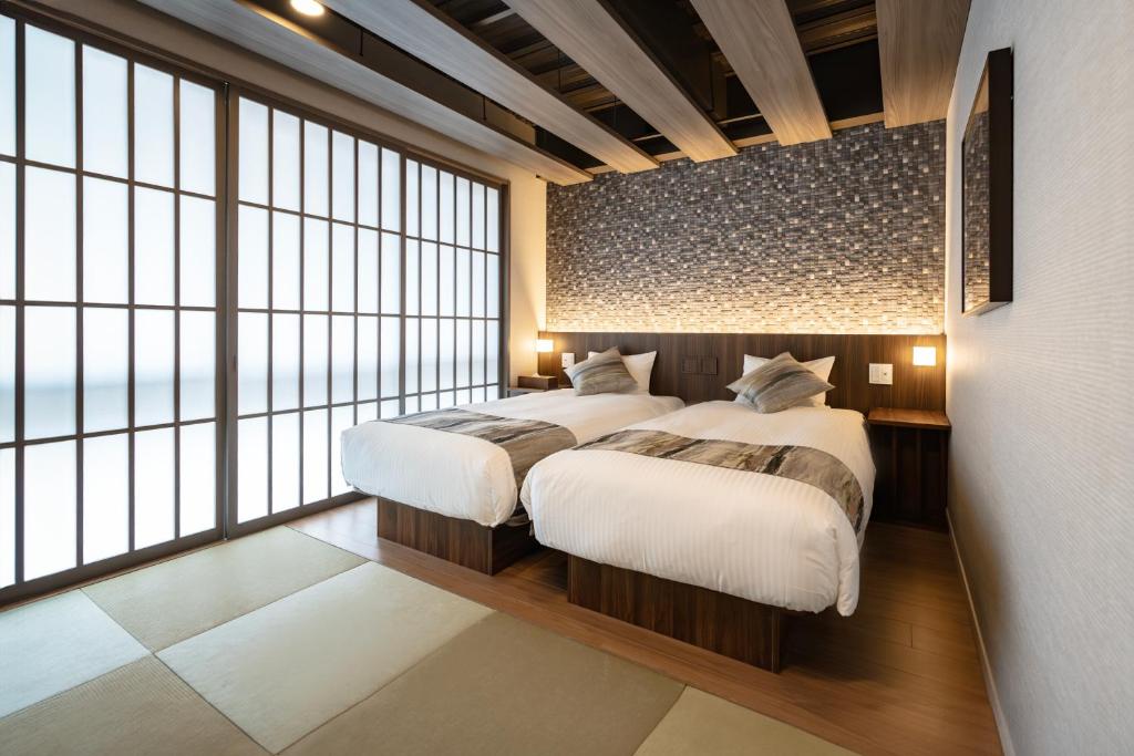 Postel nebo postele na pokoji v ubytování 谷町君Hotel Crush On 京都四条烏丸