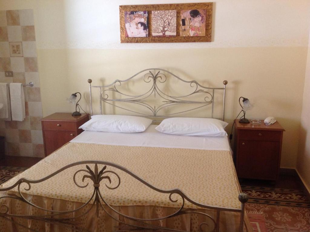 Postel nebo postele na pokoji v ubytování Albergo Cavour