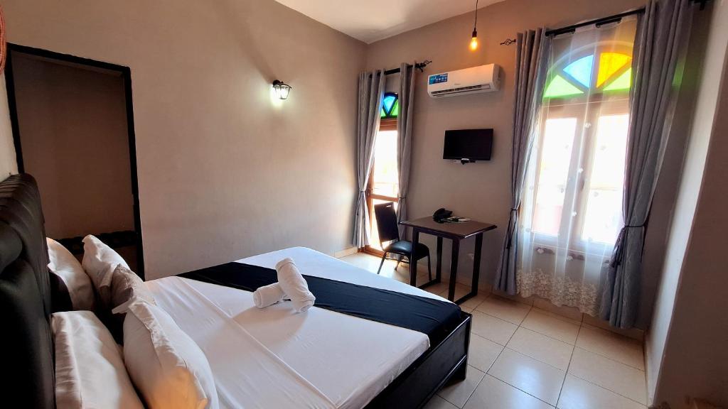 Postel nebo postele na pokoji v ubytování Rumaisa Hotel