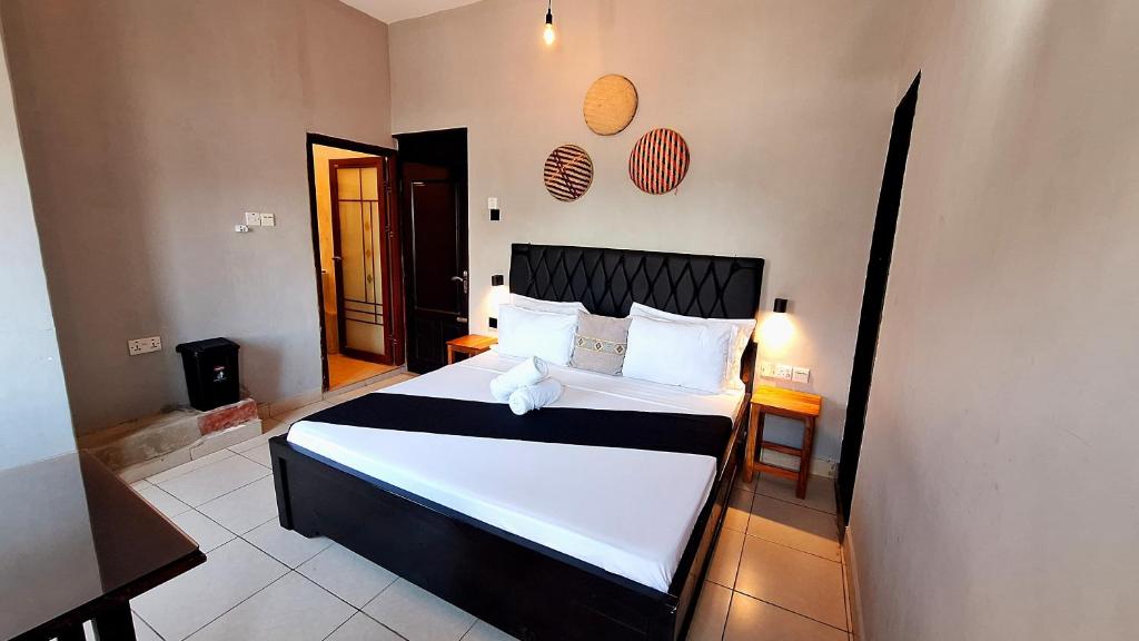 Postel nebo postele na pokoji v ubytování Rumaisa Hotel