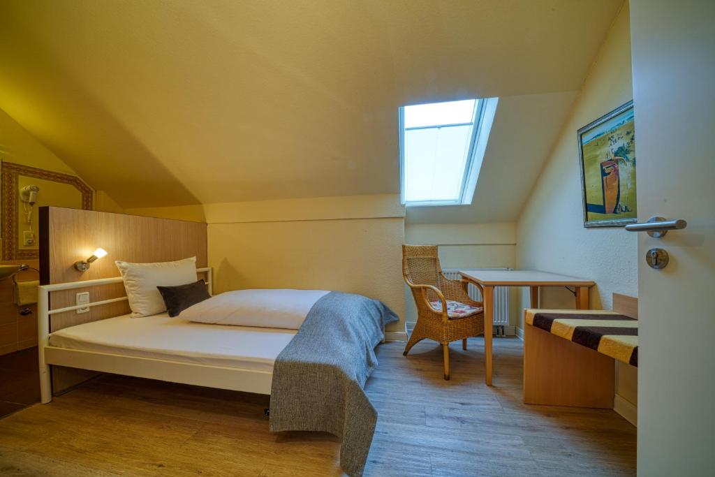Postel nebo postele na pokoji v ubytování Hotel Wissers Fehmarn