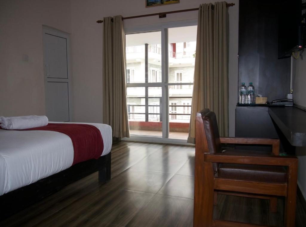 Llit o llits en una habitació de Hotel Nevis