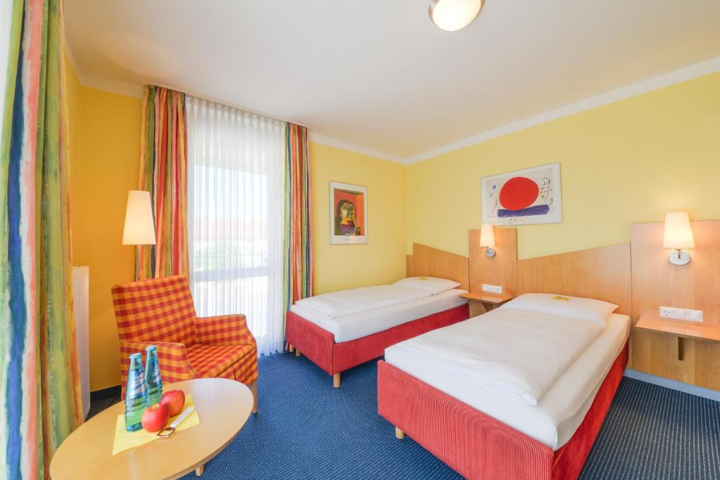 Postel nebo postele na pokoji v ubytování Hotel Beim Schrey