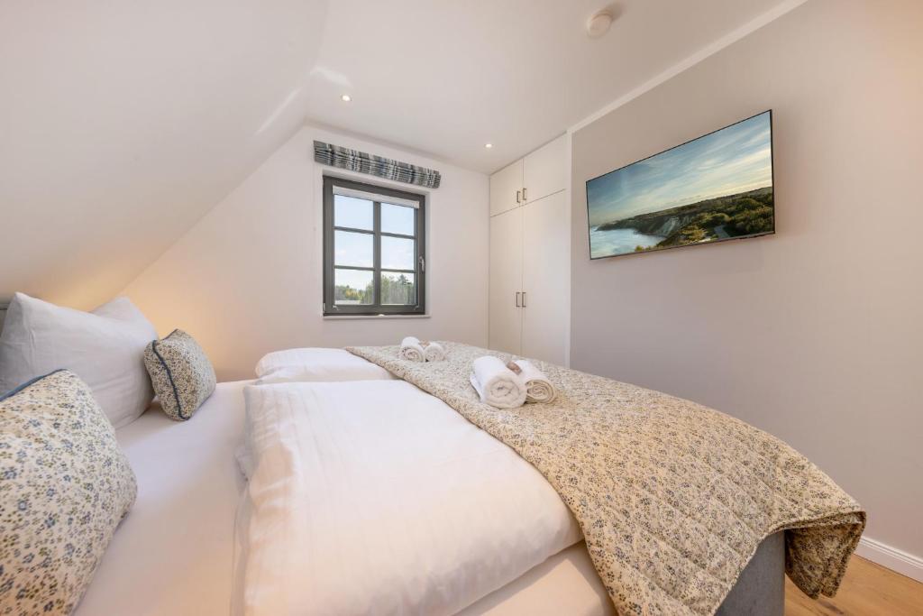 Postel nebo postele na pokoji v ubytování Ferienhaus Strandkajüte