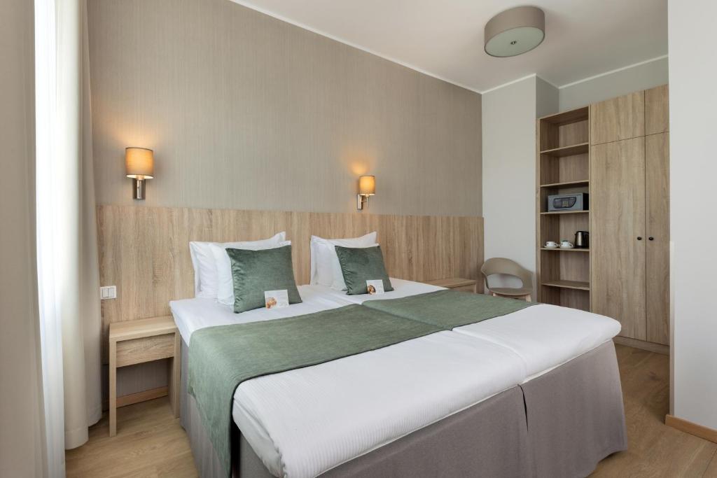 Postel nebo postele na pokoji v ubytování Kreutzwald Hotel Tallinn