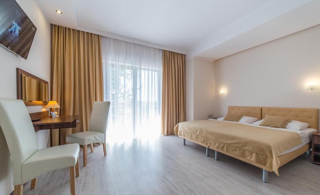 Postel nebo postele na pokoji v ubytování Dom Wczasowy Korona