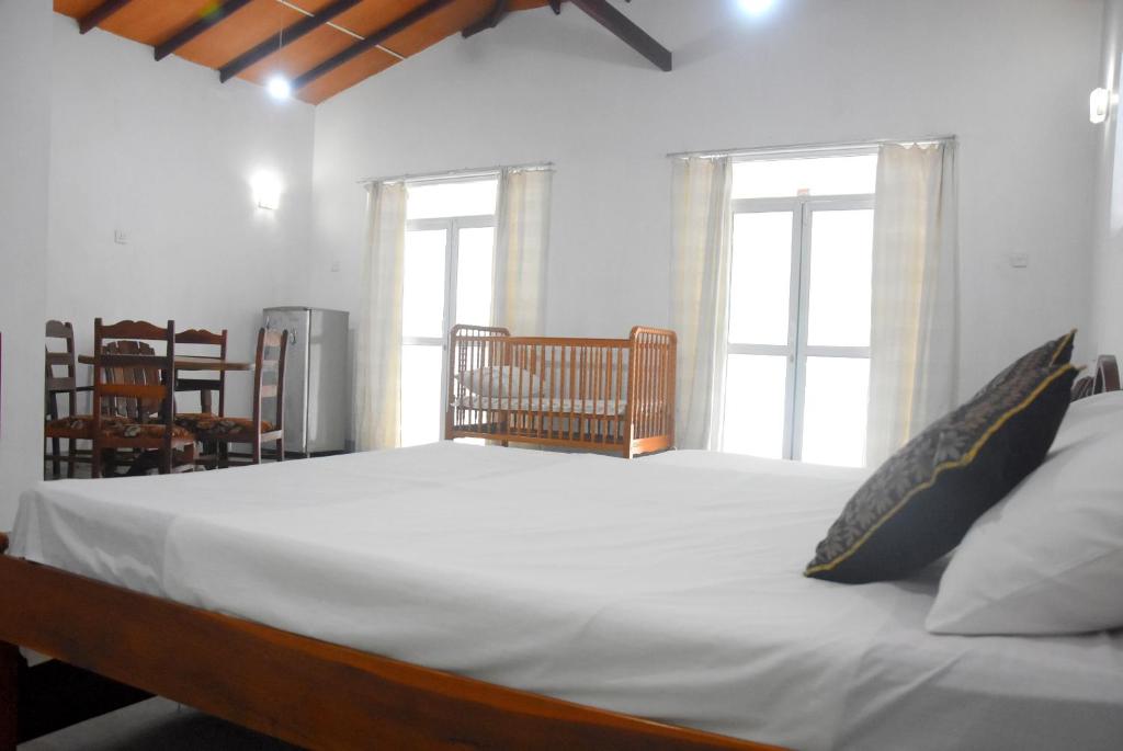 Postel nebo postele na pokoji v ubytování Insa Guest House Kandy