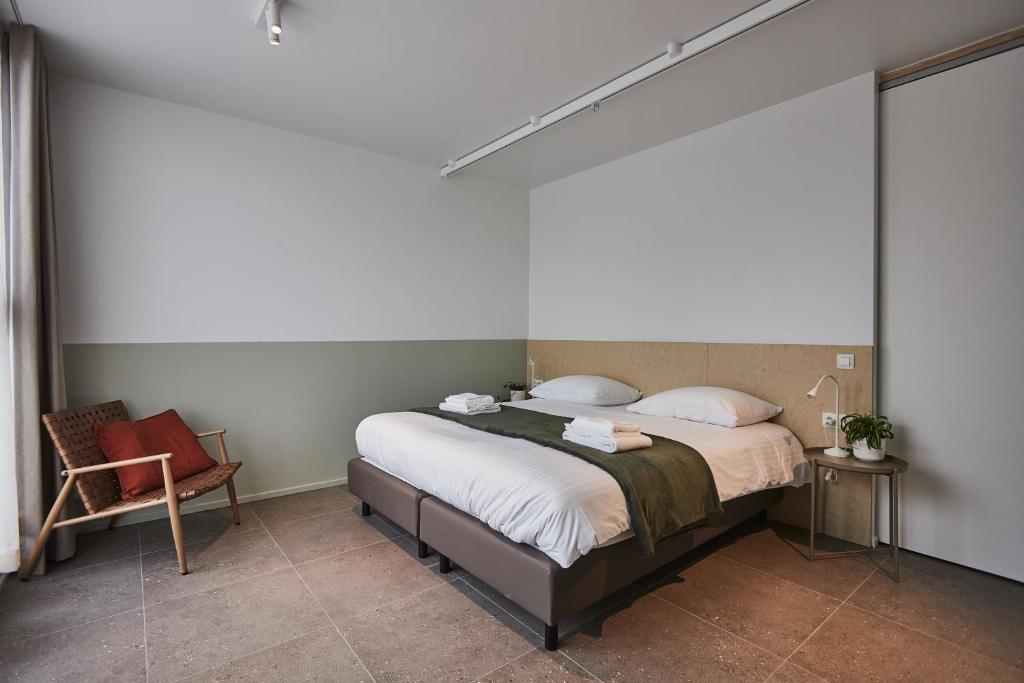 Postel nebo postele na pokoji v ubytování Vakantiewoning Het Kasterhuis