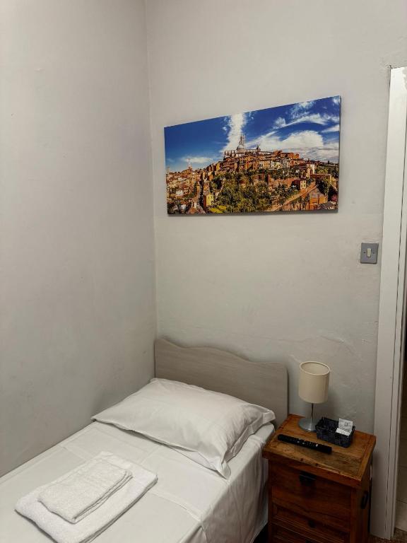 Posteľ alebo postele v izbe v ubytovaní City Rooms