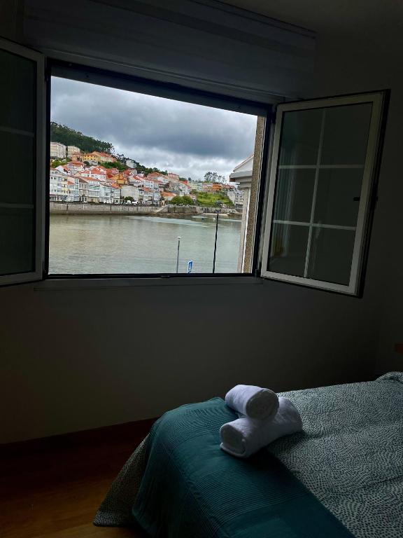 Postel nebo postele na pokoji v ubytování Apartamentos Alborada en Corcubión