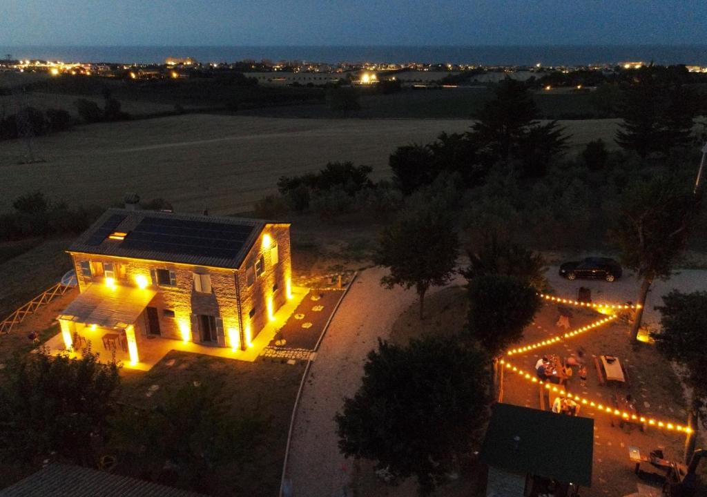 an aerial view of a house lit up at night at Casa Addis B&B in Scapezzano
