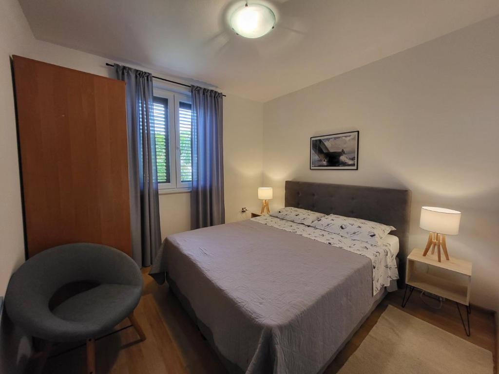 Posteľ alebo postele v izbe v ubytovaní Apartment Luciana