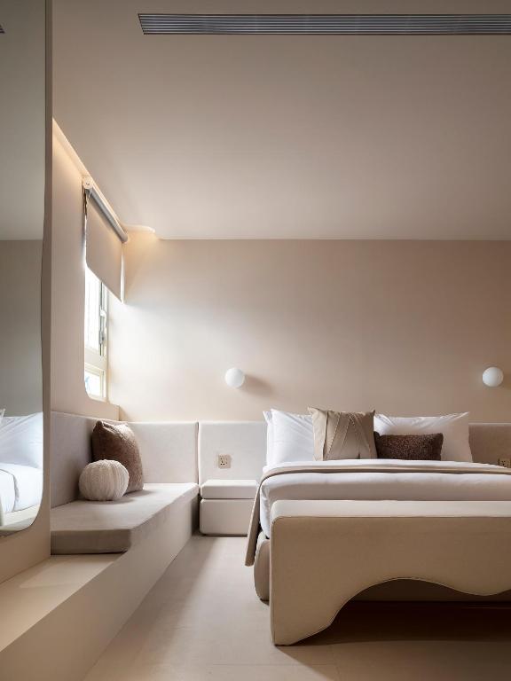 Postel nebo postele na pokoji v ubytování Lore Hotel
