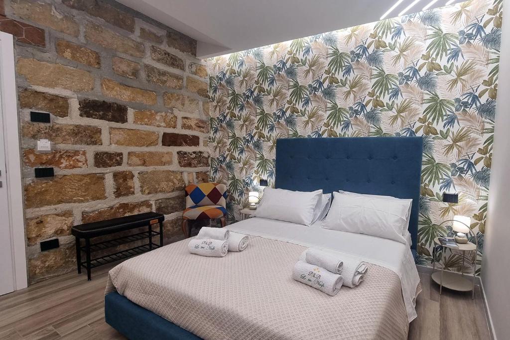 Postel nebo postele na pokoji v ubytování LE TRE NINFE Cinisi