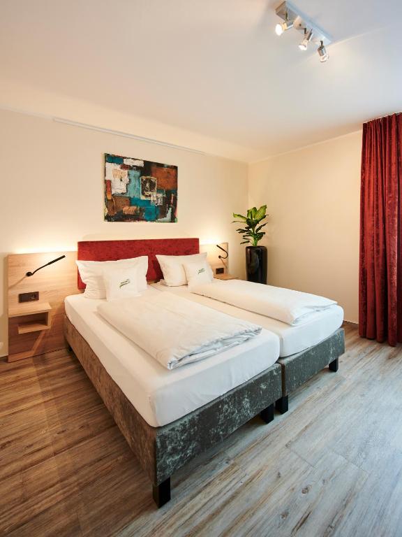 Postel nebo postele na pokoji v ubytování Art Hotel Eifel