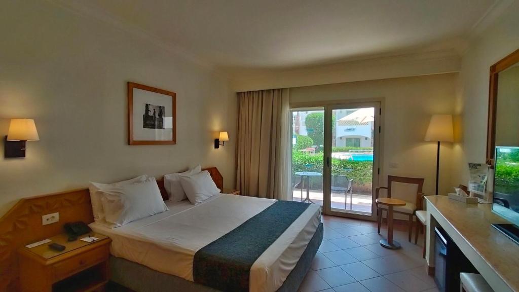 Postel nebo postele na pokoji v ubytování Camel Dive Club & Hotel - Boutique Hotel