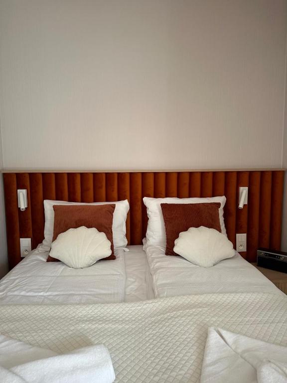 Postel nebo postele na pokoji v ubytování Apartamenty Joy Me Łukęcin