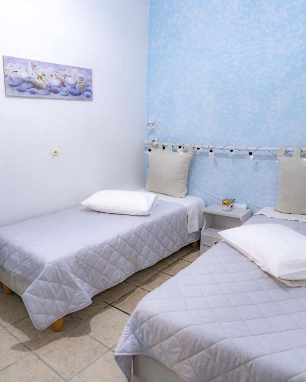 A bed or beds in a room at Shades of Blue