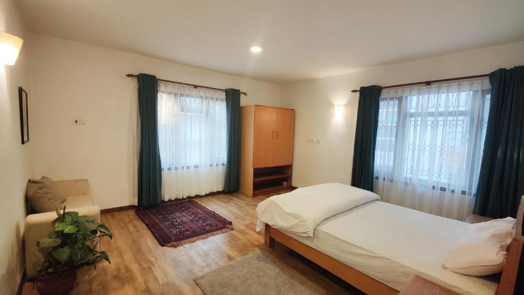 Postel nebo postele na pokoji v ubytování Nextdoor Kathmandu