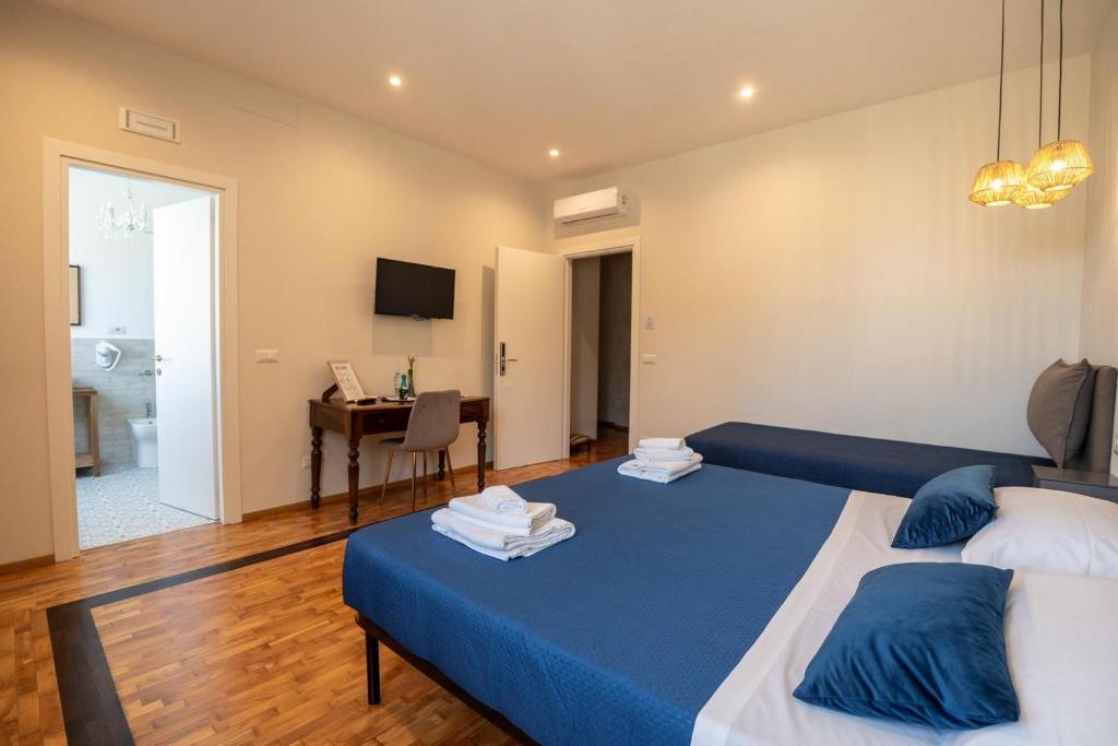 Postel nebo postele na pokoji v ubytování Namuri Comfortable Rooms
