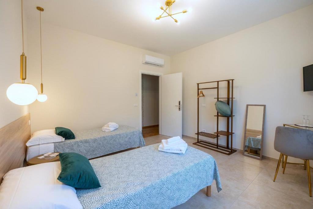 Postel nebo postele na pokoji v ubytování Namuri Comfortable Rooms