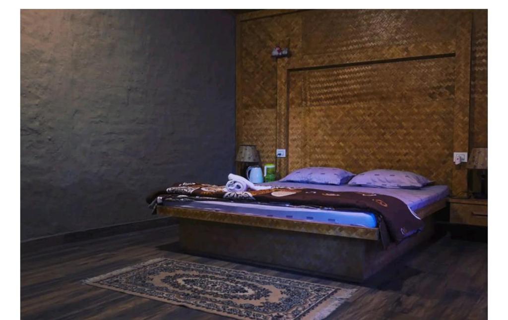 a bedroom with a bed in a room at SB Vacations & Homes in Kalimpong