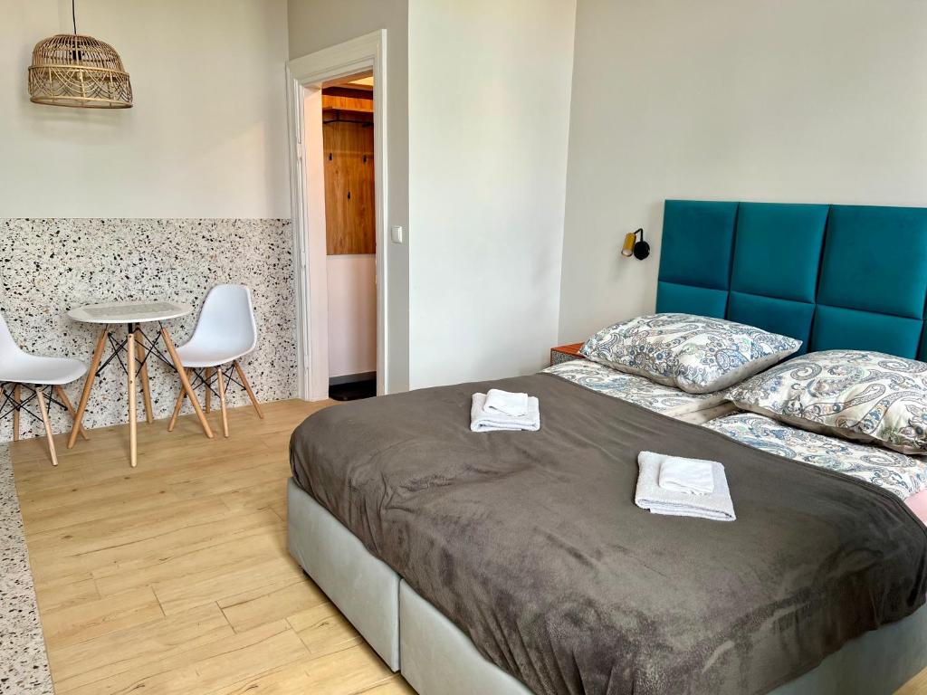 Posteľ alebo postele v izbe v ubytovaní Apartamenty Wolności 18