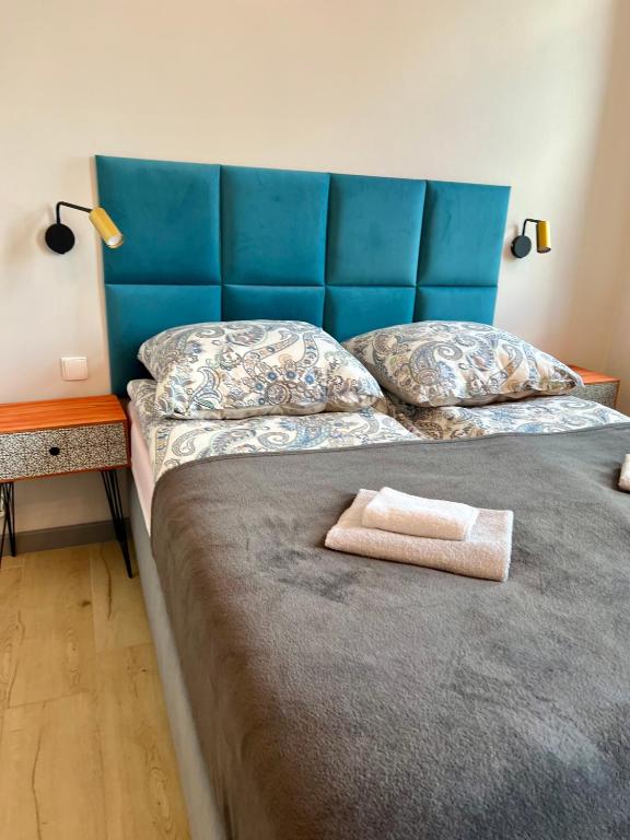 Posteľ alebo postele v izbe v ubytovaní Apartamenty Wolności 18