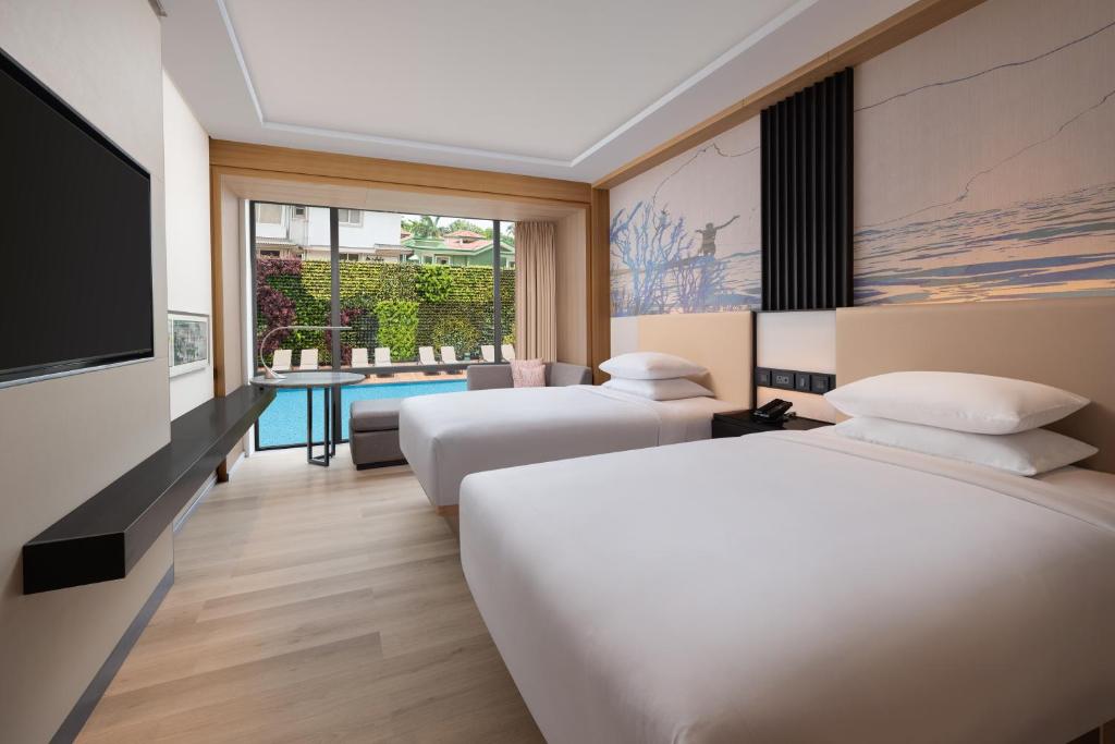 Postel nebo postele na pokoji v ubytování Courtyard by Marriott Goa Colva