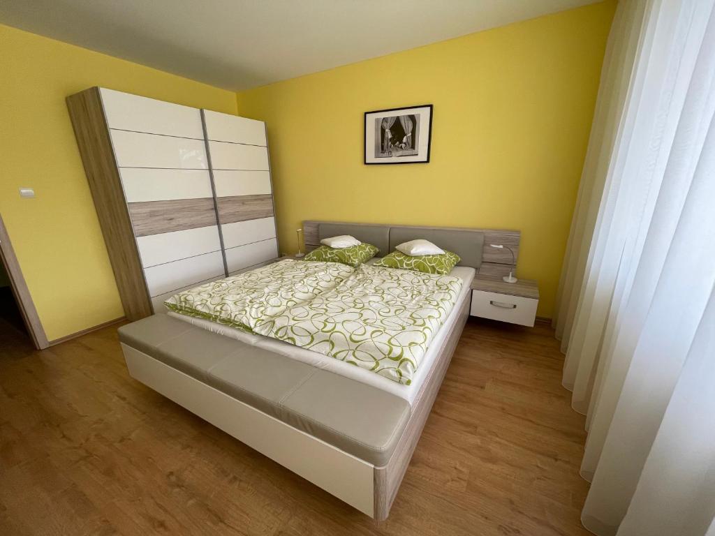 Postel nebo postele na pokoji v ubytování Apartman AiA