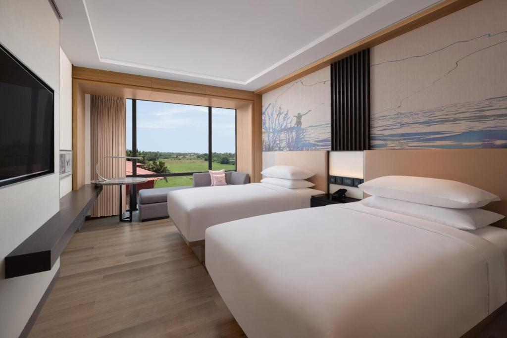 Postel nebo postele na pokoji v ubytování Courtyard by Marriott Goa Colva