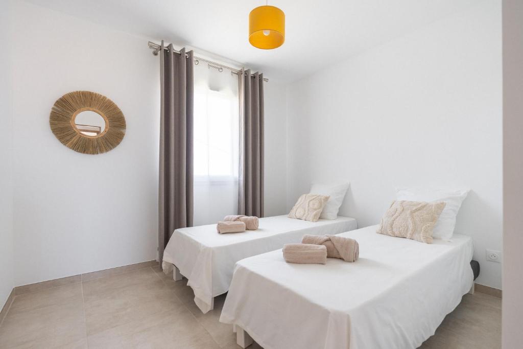 Postel nebo postele na pokoji v ubytování Villa Mimosa