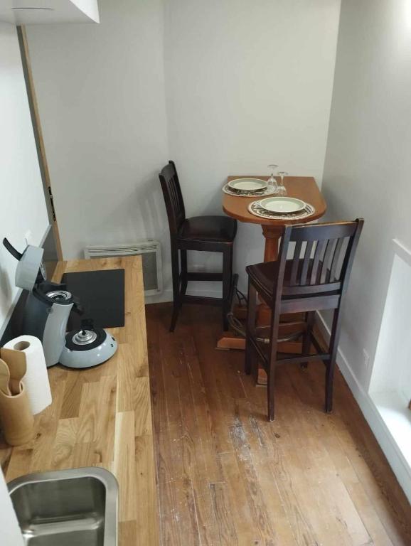 Posezení v ubytování Nid Douillet en Plein Cœur de la Ville