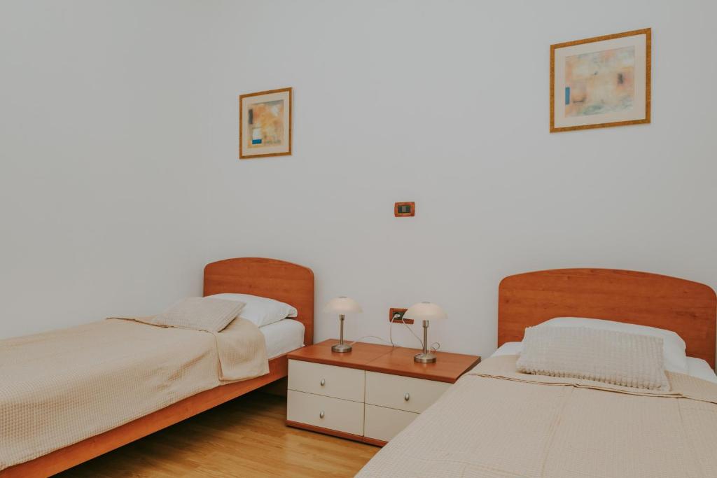 Łóżko lub łóżka w pokoju w obiekcie Villa Danex