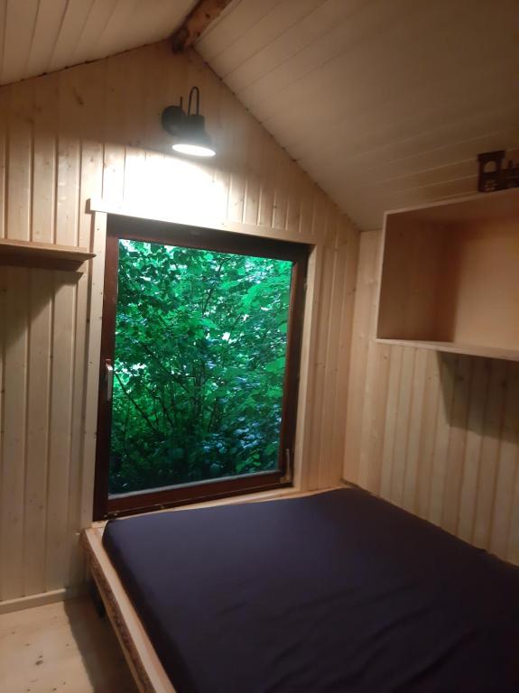 Postel nebo postele na pokoji v ubytování Baumhausnächte