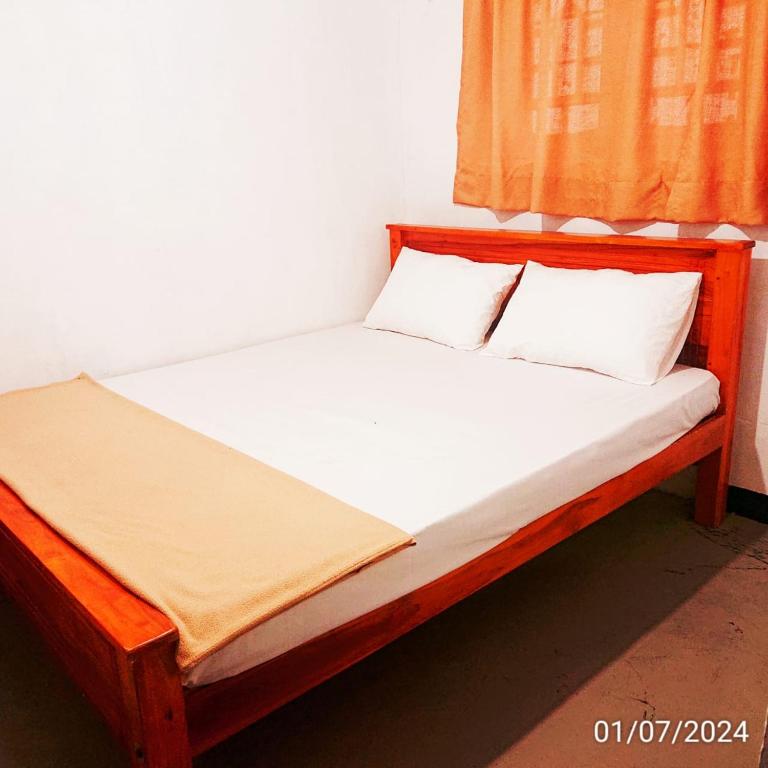 Postel nebo postele na pokoji v ubytování T-More Hotel & Hostel