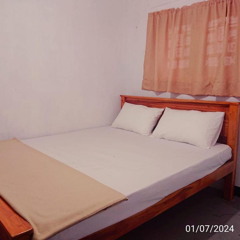 Postel nebo postele na pokoji v ubytování T-More Hotel & Hostel
