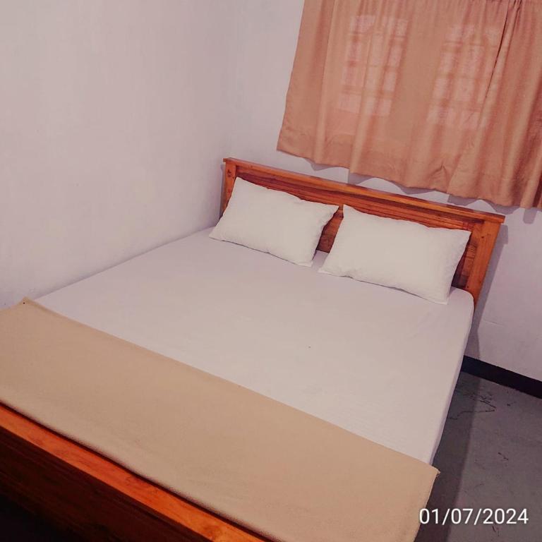 Postel nebo postele na pokoji v ubytování T-More Hotel & Hostel