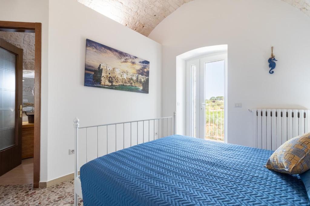 Postel nebo postele na pokoji v ubytování Corallo House