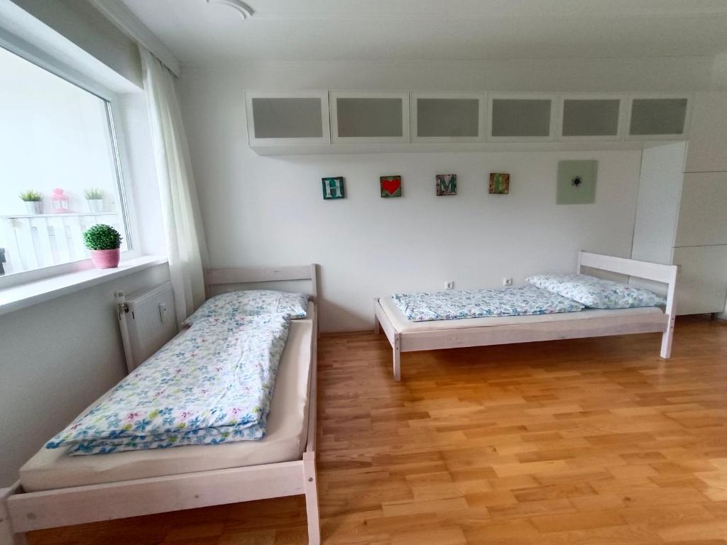 Postel nebo postele na pokoji v ubytování Suite-Traunsee
