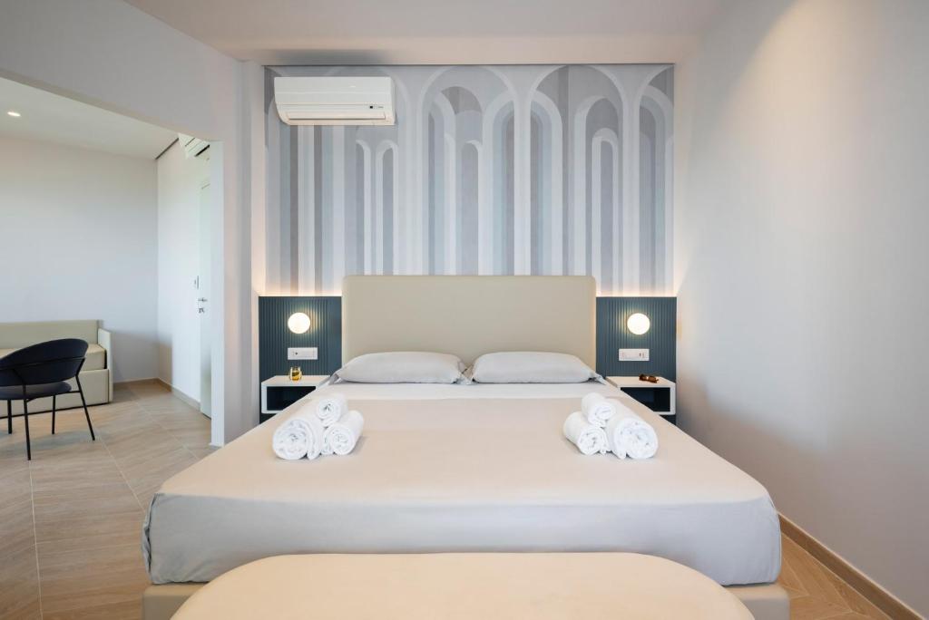 Postel nebo postele na pokoji v ubytování Hotel Playa Suite