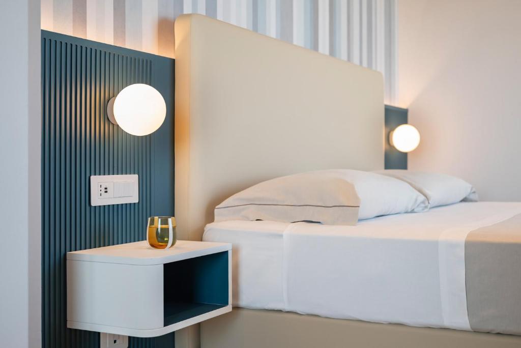 Postel nebo postele na pokoji v ubytování Hotel Playa Suite