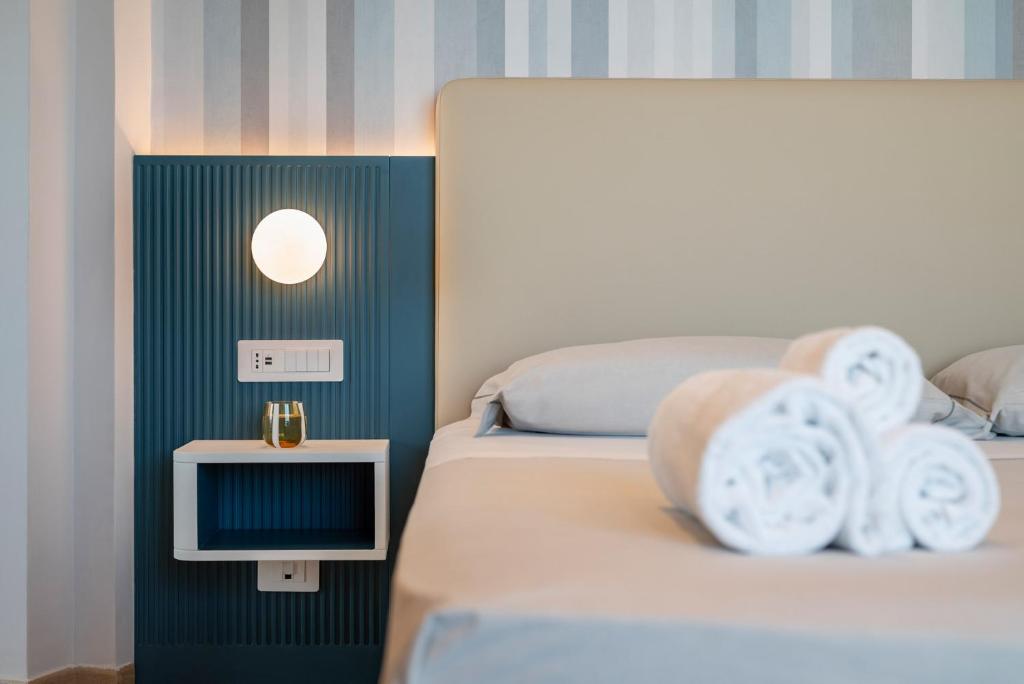 Postel nebo postele na pokoji v ubytování Hotel Playa Suite