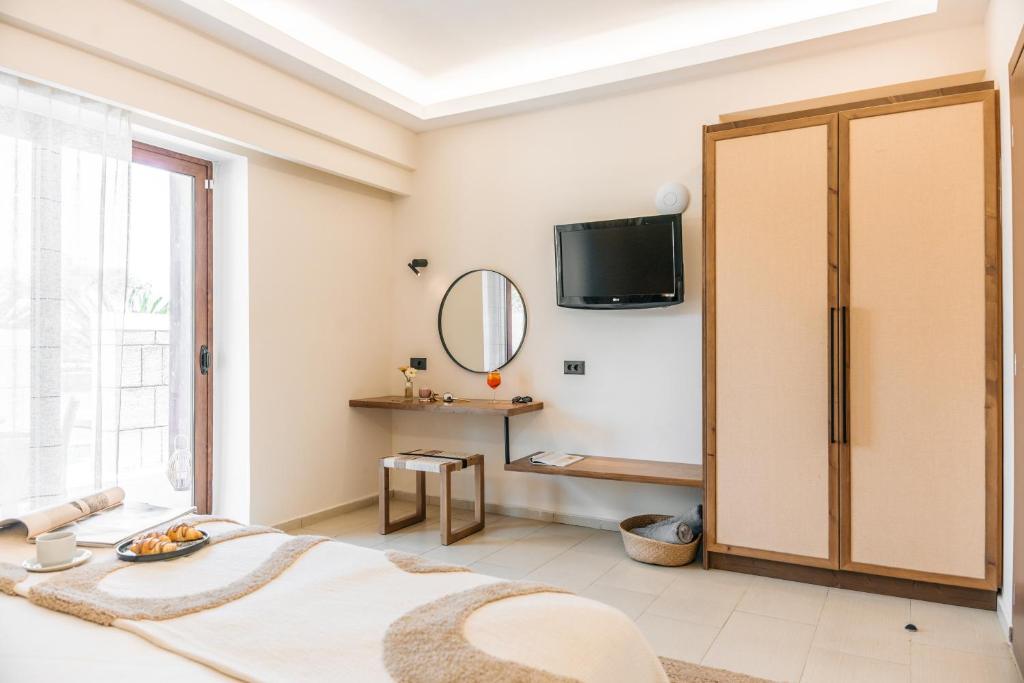 TV a/nebo společenská místnost v ubytování Villa Di Mare Seaside Suites