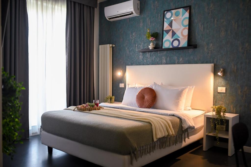a bedroom with a large bed in a room at Urban Elegance - Stylish Central Accommodation in Bucharest