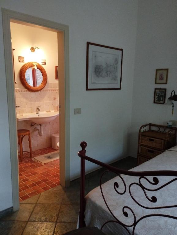 Postel nebo postele na pokoji v ubytování Appartamenti Villa Lina - La Sorella