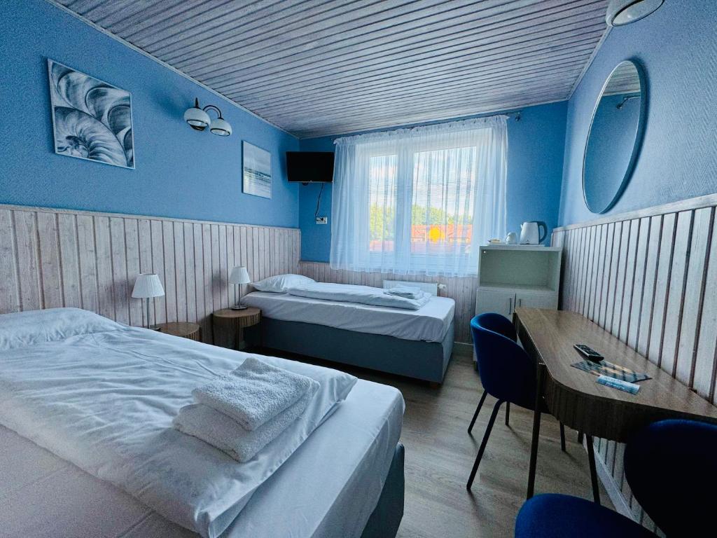 Postel nebo postele na pokoji v ubytování Willa Marlin
